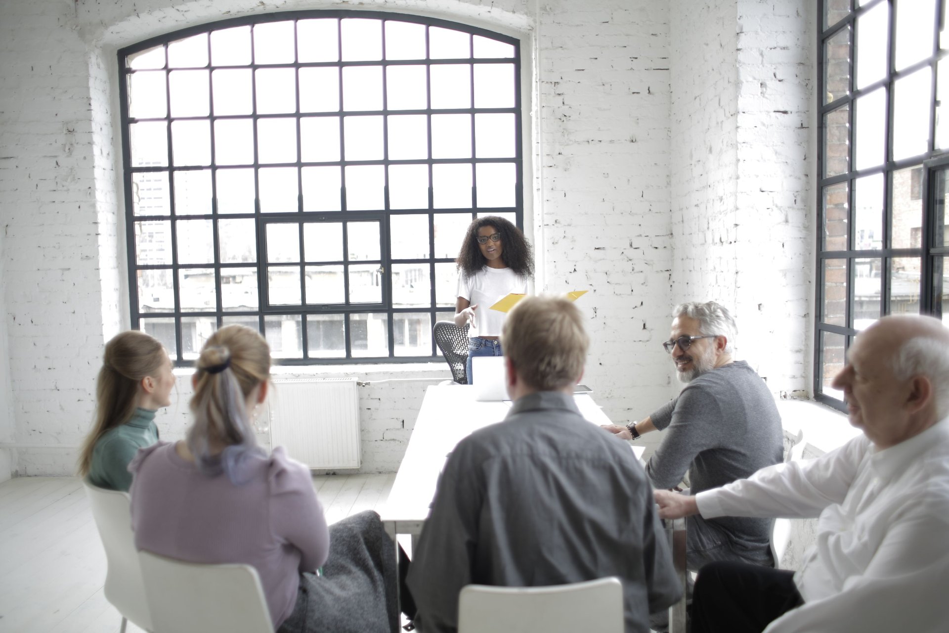 Team gathered around a table during a portfolio planning discussion